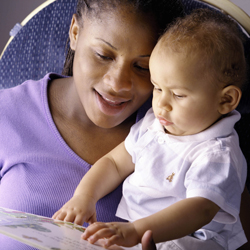 Mother reading to her baby