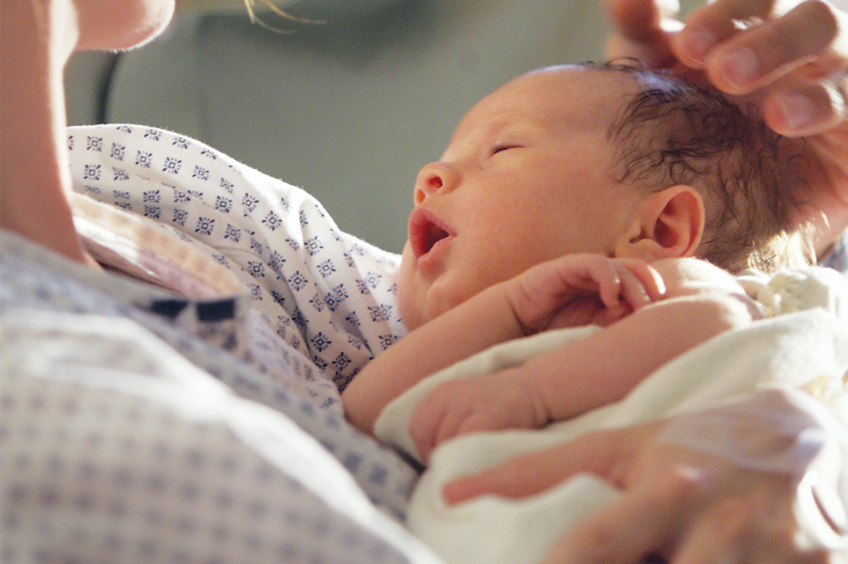 Mother holding newborn