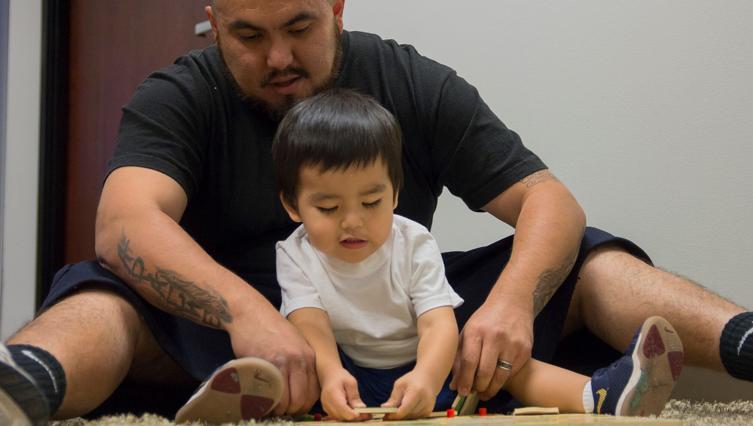 Father and son playing together