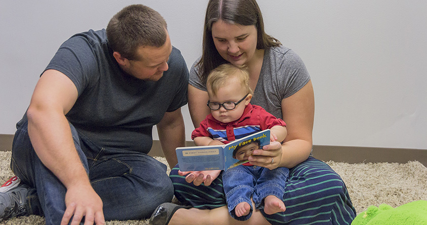 Family with child reading