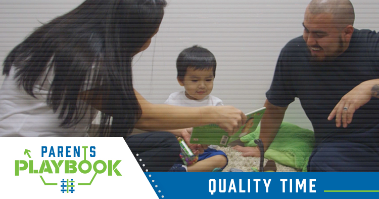 parents read book and spend quality time with toddler