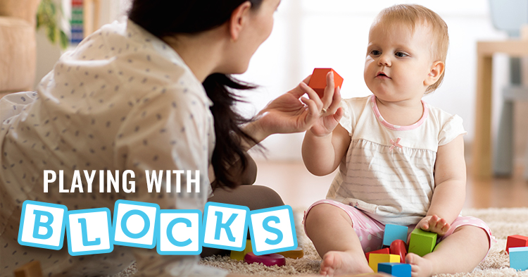 baby playing with blocks