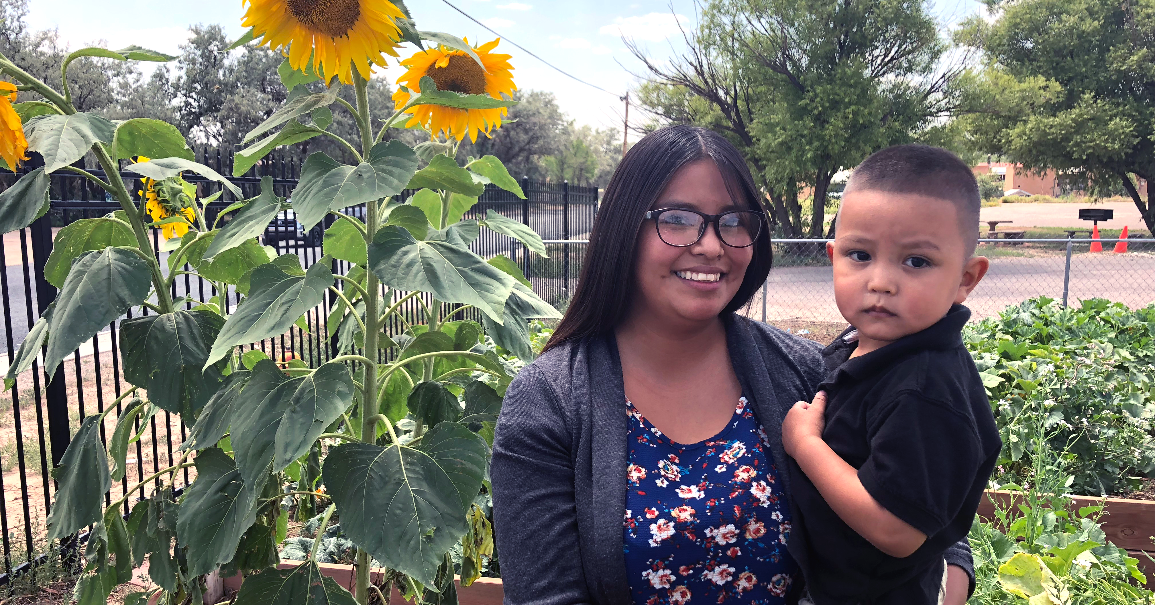 Mom and son near sunflowers