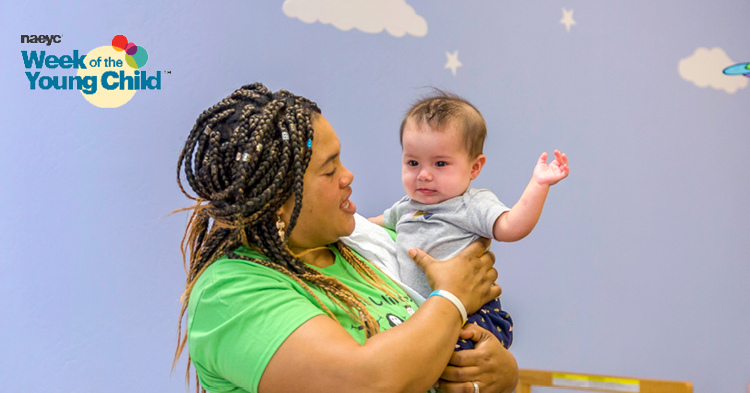 caregiver holding a baby