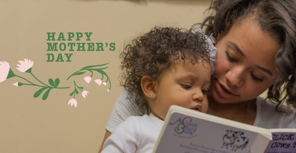 Mother reading to young toddler