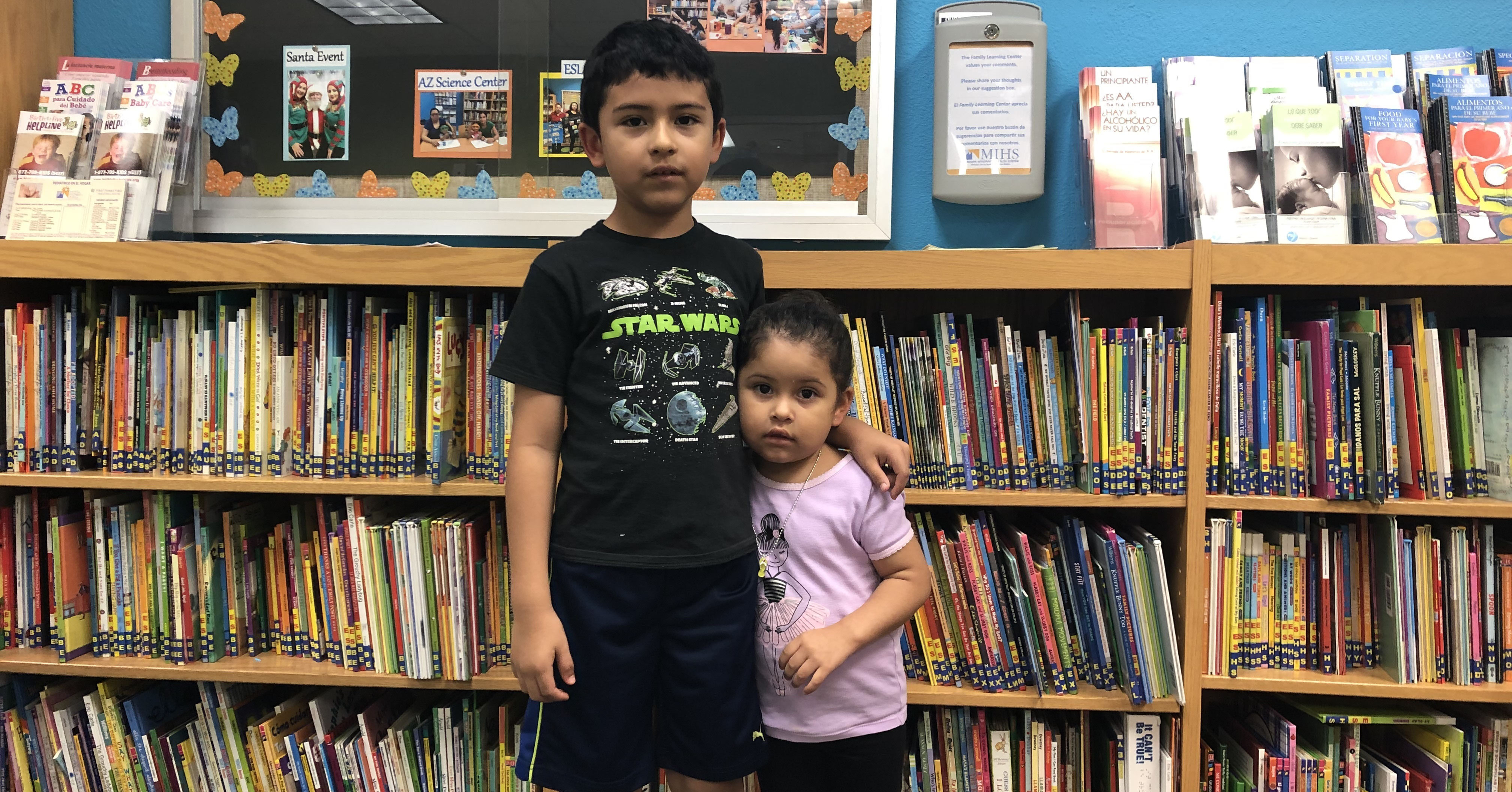 Brother and sister in library