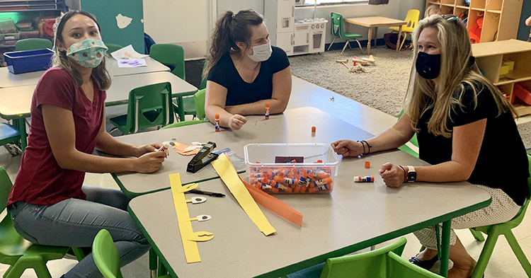 early childhood educators siting in a children's classroom