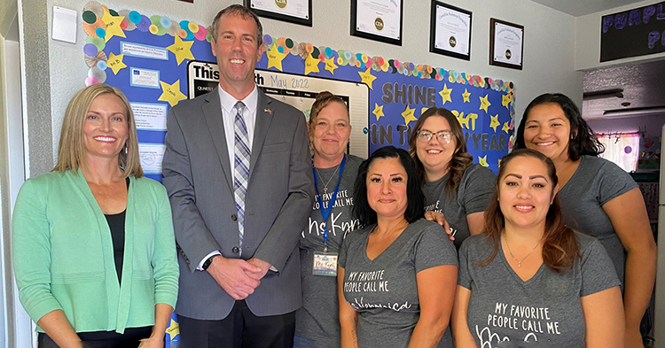 Group of early childhood teachers standing with mayor and FTF Sr. Director Ashley Pascual