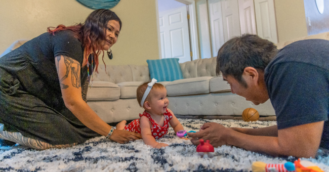 Mom and dad on the floor with baby daughter, 10 minutes with your child