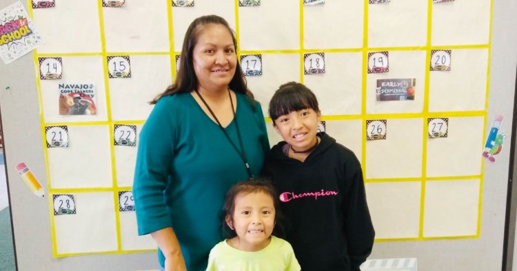 Mother standing with her two children